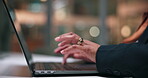 Hands, laptop and typing with business person in office at night for planning, report or research. Computer, feedback and keyboard with employee at desk in workplace for evening administration