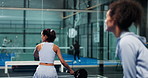 Racket, sports and women on padel court for practice, activity or fitness with exercise. Competition, training and female athletes with indoor cardio workout, hobby or tournament with partnership.