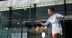 Action, athlete and playing padel on court for match practice, game training and workout energy. Low angle, woman and serving ball at sports club for technique exercise, fitness performance and skill
