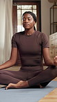 Meditation, black woman and breathing with yoga in home for health, wellness and aura in living room. Relax, holistic and peace of female person in lounge with spiritual practice for zen or chakra
