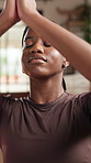 Meditation, black woman and prayer hands with yoga in home for health, wellness and aura in living room. Pilates, holistic breathe and female person in lounge for spiritual practice and zen or chakra