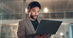 Business, man or typing on laptop in office for trade execution, brokerage account or data analysis. Night trader, employee and happy with tech for reading market trends, currency price and overtime
