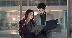 Woman, businessman and tablet with discussion at night, office and review project at media company. People, writer and journalist team with tech, laptop or talk with feedback for article at agency