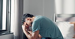 Headache, stress and man in bedroom, mental health and pain with anxiety, morning and burnout. Home, tension and person with emotions, sad and migraine with loss, frustrated and pressure with grief