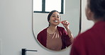 Brushing teeth, mirror or woman in bathroom, dental hygiene or morning with grooming routine. Home, oral health or person with toothbrush, wellness or cleaning mouth with fresh breath and reflection