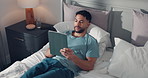 Tablet, above and man in bed for online connection, social networking and internet in home. Relax, happy and person on digital tech for streaming videos, browse website and notification in bedroom