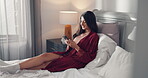 Laugh, phone and reading with woman in bedroom for social media, text message update and relax. Online meme, morning and network with person and mobile in home for communication app, typing and joke