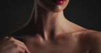 Hand, shoulder and woman in studio for skincare, dermatology and self care. Model, cosmetics and makeup with aesthetic for shine, beauty and health for skin wellness isolated on black background