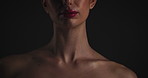 Aesthetic, dermatology and cosmetic with woman in studio on dark background for shadow, art or cosmetology. Beauty, skincare and lighting for serious model in shade for change, transformation or glow