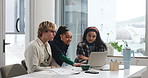 Laptop, pointing and tablet with business people in office together for feedback or review. App, computer and explain with employee group at desk in workplace for planning, strategy or training