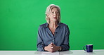 Mature woman, face and news anchor with green screen at studio, mock up space and broadcast on television. Person, speaker and journalist with info, chromakey and story presentation with tv show