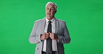 Presenter, mature man and journalist by green screen for broadcast, live streaming or announcement. TV network, talking and portrait of male news reporter with media update or speech by chroma key.