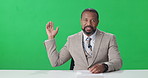 Black man, face and news reporter with green screen, talk and point for headlines, update or info at studio. African person, speaker or presenter with mockup space, chromakey and tv show in Nigeria