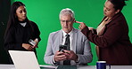 News anchor, makeup and presenter with man on green screen for broadcast touch up, production and help. Journalist reporter, stylist team and talk show host with person in studio for cosmetics