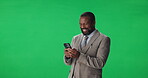 Laughing, black man and employee with smartphone, green screen or communication with contact on web. Studio, mature person and funny joke on message, mockup space and networking with mobile and chat