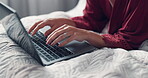 Typing, laptop and hands of woman in bed of home for remote work, blog editing and research. Freelancer, article review and update on writing platform with person in bedroom of apartment for post