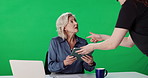 Woman, tv news and tablet in studio with producer, discussion or prepare with green screen. Person, presenter and host with tech, production staff or application for notes with mock up space for show