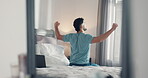 Stretching, wake up and back with man in bedroom for morning routine, relax and health. Start of day, comfortable and wellness with male person in bed of home for peace, calm and muscle relief