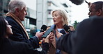Politician, woman and speaking with journalist for news, government policy and opinion in city. Press conference, politics and talking to reporter for interview, question and announcement for media