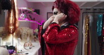 Wig, makeup and backstage with drag performer in studio for getting ready, fashion and lgbt culture. Theater preparation, queer identity and cosmetics with person in dressing room for beauty