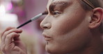 Makeup brush, drag artist and person backstage ready for performance, self expression and creative show. Beauty, aesthetic and performer with cosmetics, apply eyeshadow and makeover in dressing room