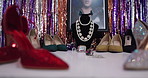 Drag, fashion display and shoes on dressing table for theater, jewelry or photo frame of artist. Lgbtq, closet or wardrobe setup with necklace on mannequin, style or high heels showcase with sparkle