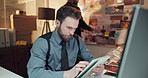 Computer, tablet and detective in office with typing for research on case with problem solving. Technology, night and professional male private investigator with surveillance for investigation.