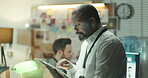 Detective, reading and tablet with man in office for criminal records, arrest warrant and night. Crime investigation deadline, evidence report and digital testimony with person in police department
