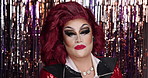 Face, beauty and drag artist with confidence for show, performance and self expression in theater. LGBTQ, cosmetics and portrait of person with makeup, art and  aesthetic for individuality in club