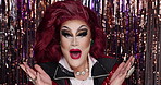 Face, reaction and surprise with drag queen in night club for identity, performance or self expression. Emoji, makeup and wow with lgbt person in theater for announcement, cosmetics or individuality 