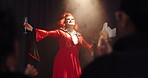 Applause, champagne and spotlight with drag performer in theater for lgbt culture, nightlife and stage show. Queer identity, entertainment and winner with person at event for celebration and pride