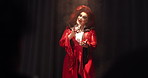 Face, person and drag performer with mic for talking, hosting show and public speaking for theatre. Portrait, artist and chat in spotlight with storytelling, performance event and creative expression
