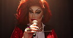 Face, person and drag artist with mic for talking, hosting show and public speaking for theatre. Portrait, performer and chat in spotlight for storytelling, performance event and creative expression