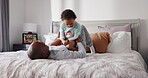 Tickling, child and fun with dad in home, playing and laughing in bedroom, bonding and black family. Happy, boy and break with father in house, games and man with son, together or love in morning
