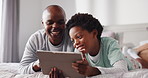 Black family, dad and tablet with child in bed for entertainment or online subscription in home. Happy father, son and laughing with technology for morning, funny games or humor together in bedroom