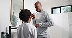 Bathroom, dad and talking to son, dental care or instruction for grooming in home, learn or routine. Teaching, wellness and hygiene of mouth, black man and boy with bamboo toothbrush for oral health