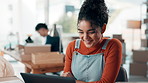 Laptop, logistics and happy woman in office for small business, distribution or supply chain. Smile, shipping and worker with computer for stock management, order fulfillment or reading review online