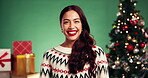 Laughing, Christmas and event with face of woman in studio for celebration, holiday season and gift giving. Festive party, joke and happiness with person on green background for xmas and December