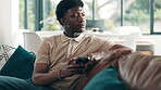 Thinking, phone and relax with black man on sofa for text message, communication app and reflection. Contact, networking and idea with person in living room of home for social media and connection