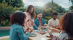 Lunch, share and barbecue with friends for celebration, summer vacation or bonding. Conversation, party and hot dog with group of people on patio of home for social event, reunion and bbq together