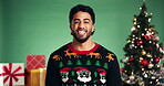 Laughing, Christmas and party with face of man in studio for celebration, holiday season and gift giving. Festive event, joke and happiness with person on green background for xmas and December