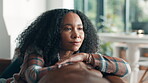 Woman, relax and thinking on sofa in home for reflection, daydreaming and weekend break. Smile, peaceful and african person with wondering in living room with contemplating, nostalgia and remember