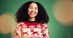 Happy woman, face and Christmas sweater in studio with lens flare, laugh or tradition on background. Girl, smile and festive jersey for portrait, confident or culture for xmas celebration in Brazil