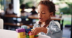 Building blocks, education and game with boy in home for child development, learning or puzzle. Problem solving, wooden toys and motor skills with kid in family house for geometric object and playing