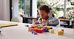 Building blocks, playing and game with boy in home for child development, education or puzzle. Problem solving, wooden toys and motor skills with kid in family house for geometric object and learning