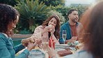 Lunch, hot dog and barbecue with friends for celebration, summer vacation or bonding. Conversation, party and food with group of people on patio of home for social event, reunion and bbq together