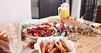 Table, food and holiday with dinner party in house, roast meal with bread and vegetables for Christmas. Gourmet cuisine, nutrition with feast or healthy supper for Thanksgiving event at home