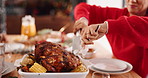Mom, hands and cutting with chicken for family feast, meal or serving at dining table. Mother, roast and preparing with knife, fork or dinner cuisine for dish, catering service or hospitality in home