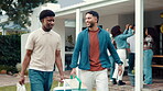 Smile, men and friends with cooler box at house for barbecue, celebration and New years party. People, talking and walk with bbq equipment, lunch reunion and prepare for social gathering in backyard