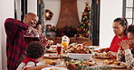 Happy family, dining or christmas with drink for festive feast, celebration or get together in home. Parents, children or kids eating with juice, lunch or food for december holiday or meal at table
